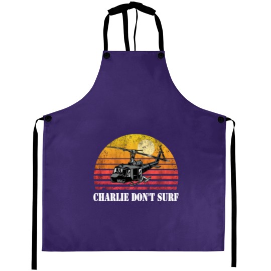 Discover Charlie Don't Surf Funny Aprons