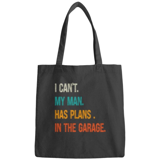 Discover i can my man has plans in the garage Bags