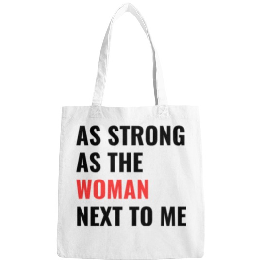 Discover as strong as the woman next to me Bags