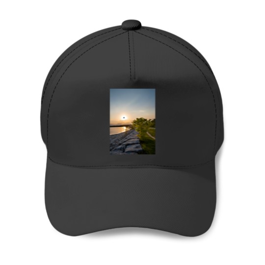 Discover bird flies in front of the sunset Baseball Caps