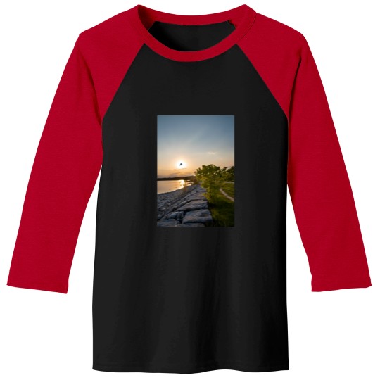 Discover bird flies in front of the sunset Baseball Tees