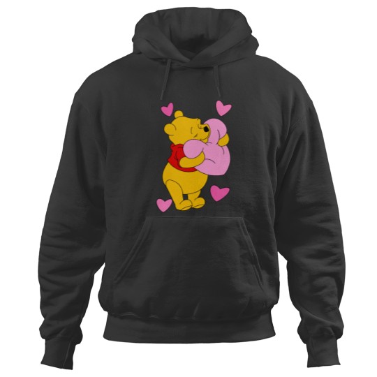 Discover Pooh hugs heart Hoodies