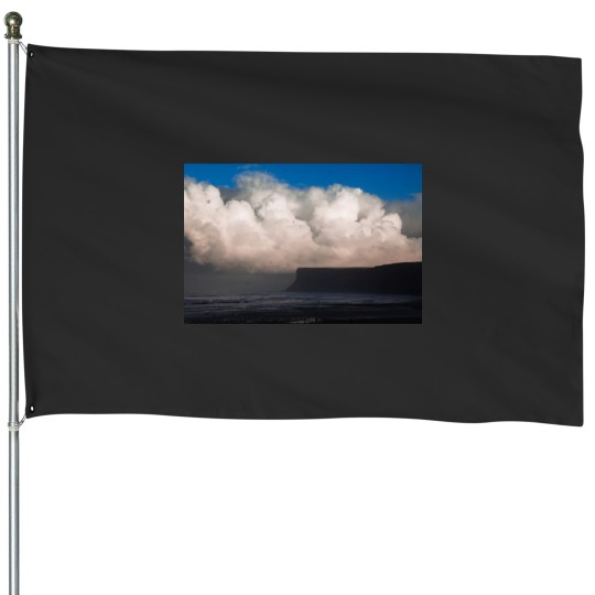 Discover Weather coming in at Saltburn beach Long House Flags