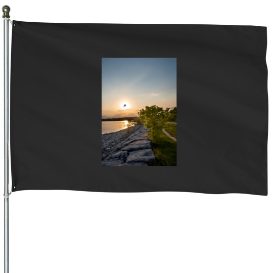 Discover bird flies in front of the sunset House Flags