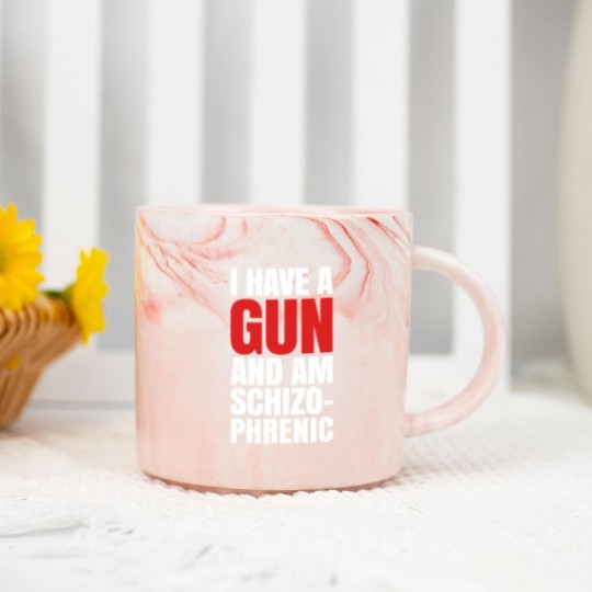 Discover I HAVE A GUN AND AM SCHIZOPHRENIC - BLACK Marble Mugs
