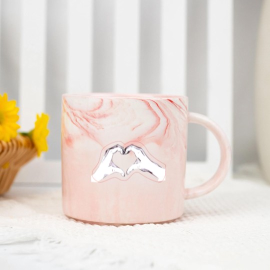 Discover Two hands making a heart Marble Mugs