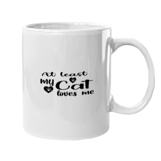 Discover AT LEAST MY CAT LOVES ME Mugs