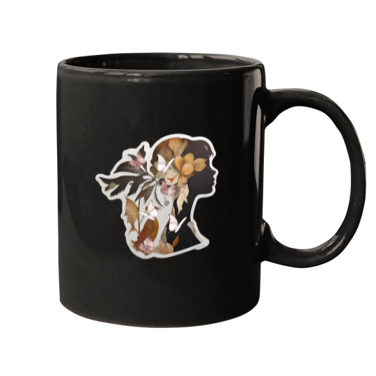 Discover a painting of a woman head ilhouetted with leave and flower Mugs
